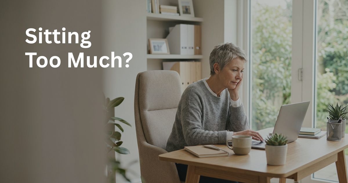 Article-38-Sitting-Too-Much-1 Woman over 50 sitting at a desk for long periods, illustrating how sedentary behaviour may affect metabolism and health after 50.